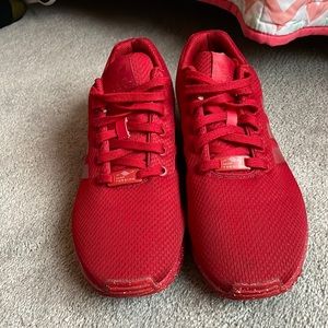 Red adidas tennis shoes